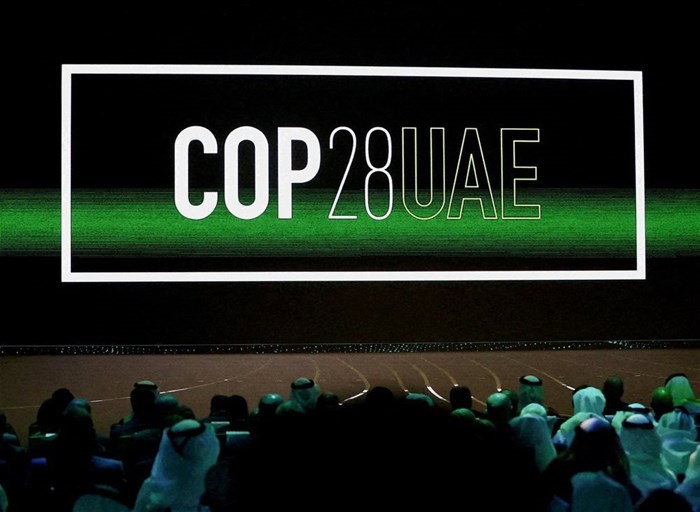 'COP28 UAE' logo is displayed on the screen during the opening ceremony of Abu Dhabi Sustainability Week (ADSW) under the theme of 'United on Climate Action Toward COP28', in Abu Dhabi, UAE, 16 January 2023. Reuters/Rula Rouhana/File Photo