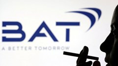 File photo: A woman poses with a cigarette in front of BAT (British American Tobacco) logo in this illustration taken 26 July 2022. Reuters/Dado Ruvic/Illustration/File Photo