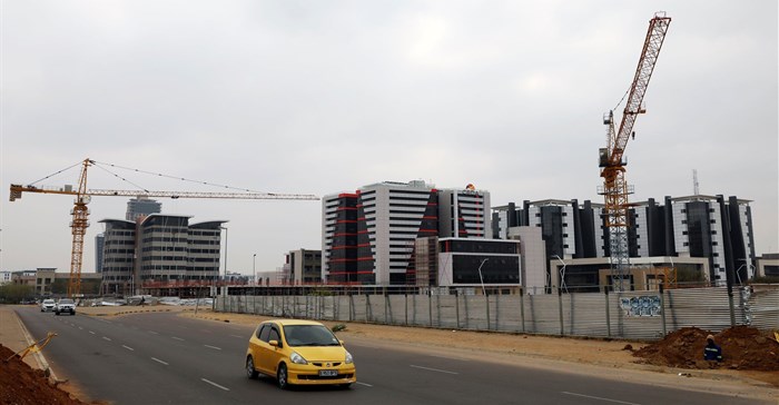 A car drives past a construction site of the Central Business District (CBD) in the capital Gaborone. Source: Reuters/Siphiwe Sibeko
