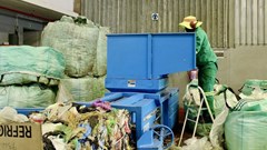Recyclable items collected and sorted at the African Reclaimers Organisation’s sorting centre are compressed using a baler machine before being sold to buy-back centres. Photo: Masego Mafata / GroundUp