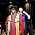 Ikalafeng is robed by Prof Betty van Vuuren. Source: UJ.