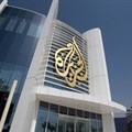 The Al Jazeera Media Network logo is seen on its headquarters building in Doha, Qatar June 8, 2017. REUTERS/Naseem Zeitoon/File Photo
