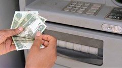 A client uses an automated teller machine (ATM) at the Commercial Bank of Ethiopia in Addis Ababa, Ethiopia, 31 July 2019. Reuters/Maheder Haileselassie Tadese/File Photo