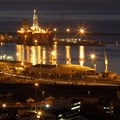 An oil rig lights up Cape Town harbour as the sun sets. The giant floating platforms are becoming regular visitors to the port as the city is marketing itself as the service hub for the lucrative oil fields off the west coast of Africa. Source: Reuters/Mike Hutchings