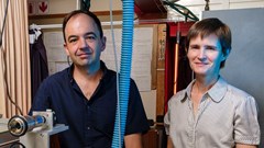 Source: Stefan Els. Pieter Neethling and Christine Steenkamp in the high resolution laser spectroscopy laboratory in the Department of Physics at Stellenbosch University.