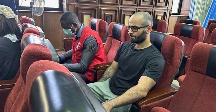 Tigran Gambaryan, an executive of Binance, the world's largest cryptocurrency exchange, sits as he waits to face prosecution for tax evasion and money laundering at the federal high court in Abuja, Nigeria, 4 April 2024. Reuters/ Abraham Achirga