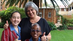 Source: Supplied. Holy Rosary pupils with principal Meerholz.