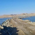 The Alexkor coffer-dam wall between two dams at high tide. Photos from a Department of Forestry, Fisheries and the Environment report titled: “Enforcement: In Loco Inspection Report – The salt/tidal flats of the Orange River Mouth Ramsar site”, published 28 January 2020.