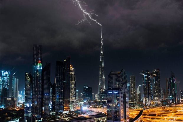 Source: A photo taken of Dubai's skyline under a stormy sky in October 2020.