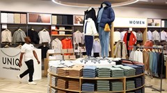A worker walks at Uniq clothing store, owned by one of South Africa's biggest supermarket retailer Shoprite Holdings during its opening at Sandton mall in Sandton, South Africa, 24 April 2024. Reuters/Siphiwe Sibeko/File Photo