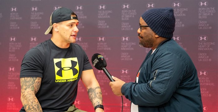 Professional boxer Kevin Lerena being interviewed by media at the launch of Under Armour's icon flagship Sandton City store