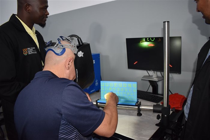 Host Dugald Pieterse trying out the simulator under the supervision of Northlink staff