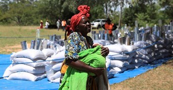 A villager arrives to collect her monthly allocations of food aid provided by the World Food Program (WFP) in Mumijo, Buhera district east of the capital Harare, Zimbabwe, 16 March 2024. Reuters/Philimon Bulawayo/File Photo