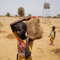 A girl carries a jerrycan filled with water at a Tolou Keur garden in the Walalde department of Podor, in the Great Green Wall of the Sahara and the Sahel area, Senegal, 11 July 2021. Reuters/Zohra Bensemra/File Photo