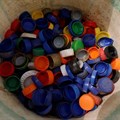 Caps collected from used plastic bottles are stored in a bucket at the Waste museum in Ibadan, Oyo State, Nigeria, 23 February 2022. Reuters/Temilade Adelaja/File Photo