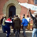 Local community members and supporters of Sustaining the Wild Coast and Greenpeace celebrated a court victory outside the Eastern Cape High Court in Makhanda in September 2022. Archive photo: Lucas Nowicki / GroundUp