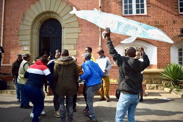 Local community members and supporters of Sustaining the Wild Coast and Greenpeace celebrated a court victory outside the Eastern Cape High Court in Makhanda in September 2022. Archive photo: Lucas Nowicki / GroundUp