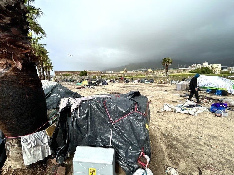 People living in makeshift shelters outside the Castle of Good Hope in Cape Town have been cold and wet this week. The site is owned by the Department of Public Works. Photos: Matthew Hirsch / Groundup