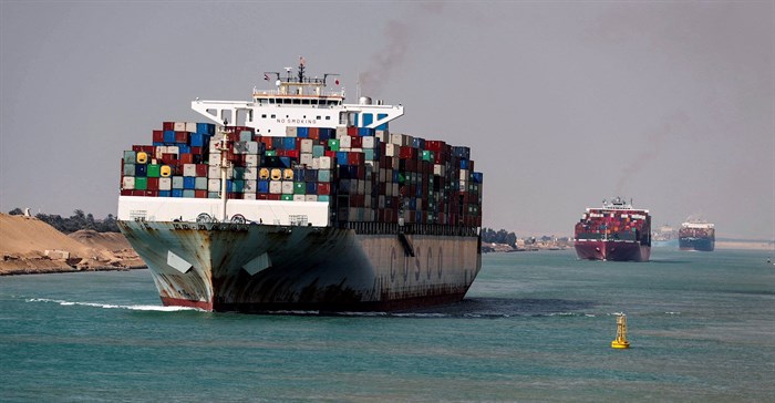 Shipping containers pass through the Suez Canal in Suez, Egypt February 15, 2022. REUTERS/Mohamed Abd El Ghany/File Photo