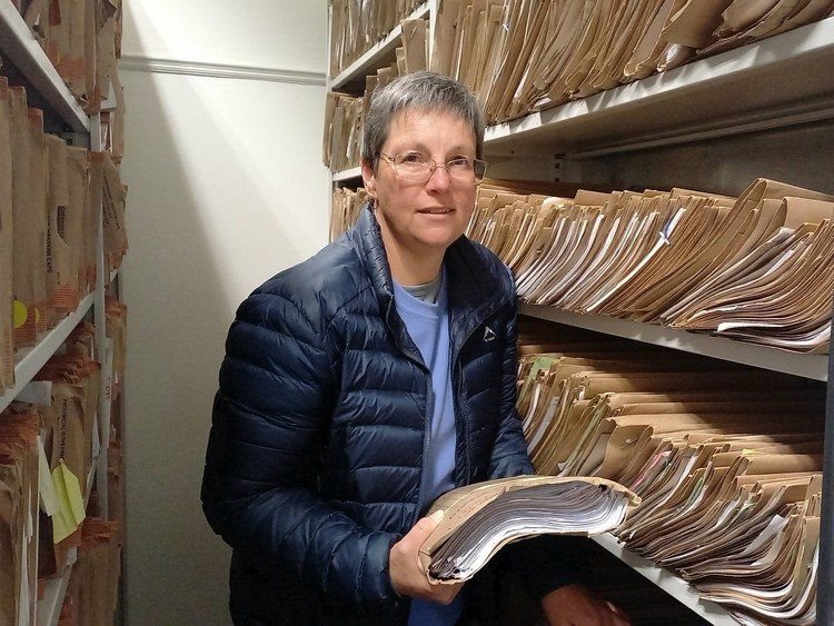 The Department of Social Development’s Annemie Van Reenen with hundreds of files in the registry at the department’s Langa office. A new app is designed to cut down on paperwork and filing for social workers. Photo: Marecia Damons / GroundUp