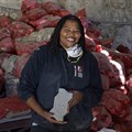 Pictured: Analisa Sukula with a recycled paver and the recycled materials behind her. Images by Mark Wessels.