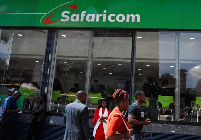 Pedestrians walk outside the Safaricom mobile phone customer care centre during the launch of its 5G internet service in the central business district of Nairobi, Kenya, 27 October 2022. Reuters/Monicah Mwangi/File Photo