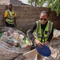 Johannes Magaela, Phillip Masitenyane and Minah Funani sort plastic items inside Funani’s yard in Tembisa. Photos: Ihsaan Haffejee / GroundUp