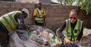Johannes Magaela, Phillip Masitenyane and Minah Funani sort plastic items inside Funani’s yard in Tembisa. Photos: Ihsaan Haffejee / GroundUp