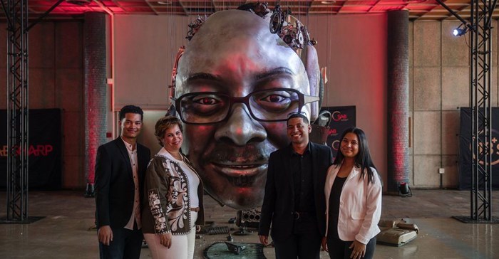 The South African Breweries has launched a campaign to discourage consumers from drinking and driving which includes a photo of two deceased using parts from the carnage of car accidents (Image supplied)