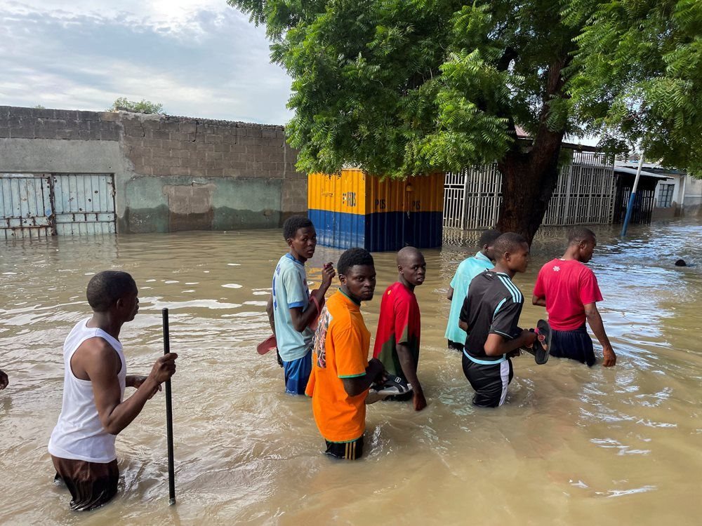 Residents walk in a flooded area during rescue operations in Maiduguri, northern Borno state, Nigeria, 12 September 2024. Reuters/Ahmed Kingimi/File Photo