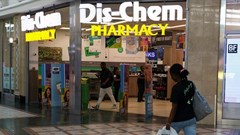 A person walks past a Dis-Chem Pharmacy outlet in Cape Town, South Africa, 22 February 2024. Reuters/Esa Alexander/ File Photo