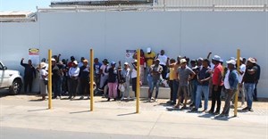 Striking workers gather outside the Mister Sweet factory in Germiston. Photo: Kimberly Mutandiro / GroundUp