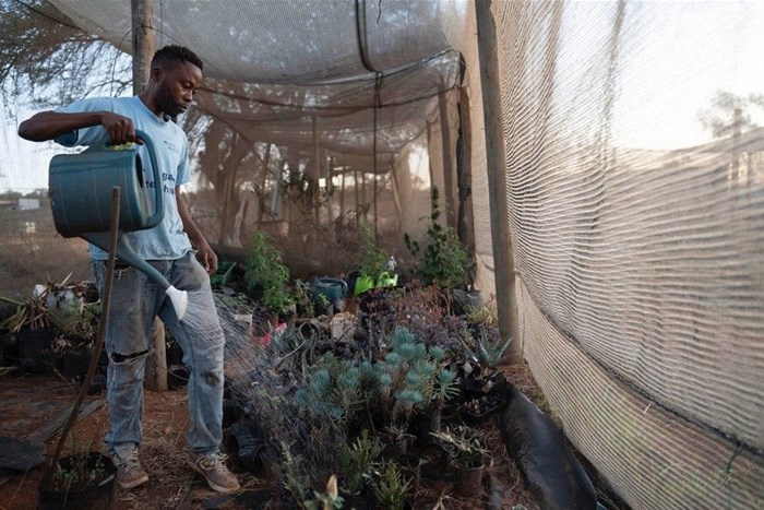 Mduduzi Tshabalala from the Vaal Environmental Justice Alliance uses water from a borehole for his plants.