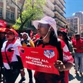 Community health workers, supported by Nehawu, picketed outside the Labour Court in Johannesburg on Tuesday. Photo: Silver Sibiya/GroundUp