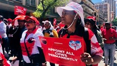 Community health workers, supported by Nehawu, picketed outside the Labour Court in Johannesburg on Tuesday. Photo: Silver Sibiya/GroundUp