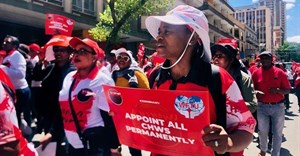 Community health workers, supported by Nehawu, picketed outside the Labour Court in Johannesburg on Tuesday. Photo: Silver Sibiya/GroundUp