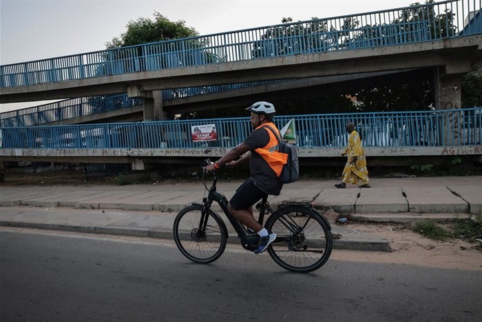 Doctor Philip Moreira, a gynaecologist and department head at Dalal Jamm Hospital, rides his electric bicycle while commuting to the hospital in Dakar, Senegal, 21 October 2024. Reuters/Zohra Bensemra/File Photo