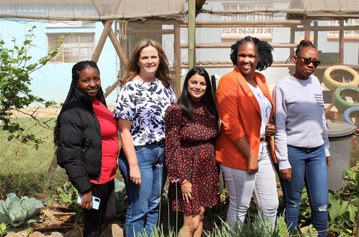 Bhavna Maharaj (group head of transformation) with the team from the Ekukhanyeni Relief Project