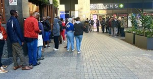 People waiting in long lines outside the VFS Global office in Cape Town on Thursday. On Friday morning, Home Affairs Minister Leon Schreiber extended the validity of the original Zimbabwe Exemption Permit to November 2025. Photo: Matthew Hirsch / GroundUp