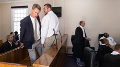 Adam Harrower from the South African National Botanical Institute and Karel du Toit who was head of the SAPS Springbok Stock Theft and Endangered Species Unit appear in the dock at the regional court in Springbok on Tuesday. Photo: Ashraf Hendricks/GroundUp