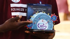 An educator uses a model of the HIV virus to illustrate a lesson on Aids to youths at a primary health centre in Kobi suburb, Abuja, Nigeria 30 November 2022. Reuters/Afolabi Sotunde/File Photo