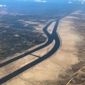 Ships are seen from a plane window, passing through the Suez Canal, Egypt. Source: Reuters/Mohamed Abd El Ghany