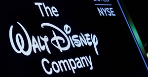 A screen shows the logo and a ticker symbol for The Walt Disney Company on the floor of the New York Stock Exchange (NYSE) in New York, US, 14 December 2017. Reuters/Brendan McDermid/File Photo
