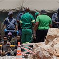 Rescued miners are seen as they are processed by police after being rescued at the mine shaft where rescue operations are ongoing as attempts are made to rescue illegal miners who have been underground for months, in Stilfontein. Source: Reuters/Ihsaan Haffejee