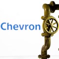 A 3D printed natural gas pipeline is placed in front of displayed Chevron logo. Source: Reuters/Dado Ruvic