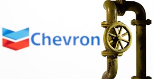 A 3D printed natural gas pipeline is placed in front of displayed Chevron logo. Source: Reuters/Dado Ruvic