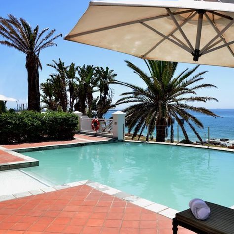 Courtyard Hotel Gqeberha's pool with a spectacular view of the ocean