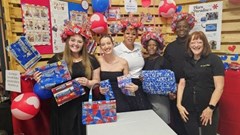 Margolite Williams from SA Harvest with fashion students demonstrating their creative use of Blue Ribbons bags.