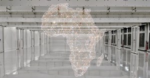 The wall fan cooled hall at ADC's CPT 1 facility in Cape Town, with a graphic of Africa overlaid. Source: Lindsey Schutters.