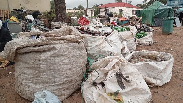 Some of the bags filled with plastic and glass bottles, and other reusable material, at the site where the waste pickers sort through their items.